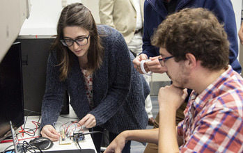 Students work together with computers